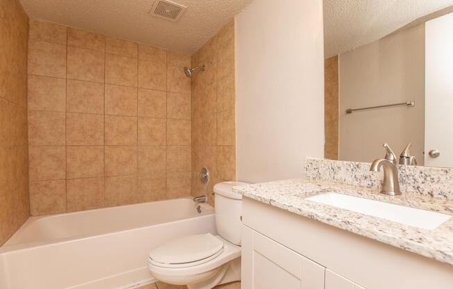 a room with a sink and a mirror