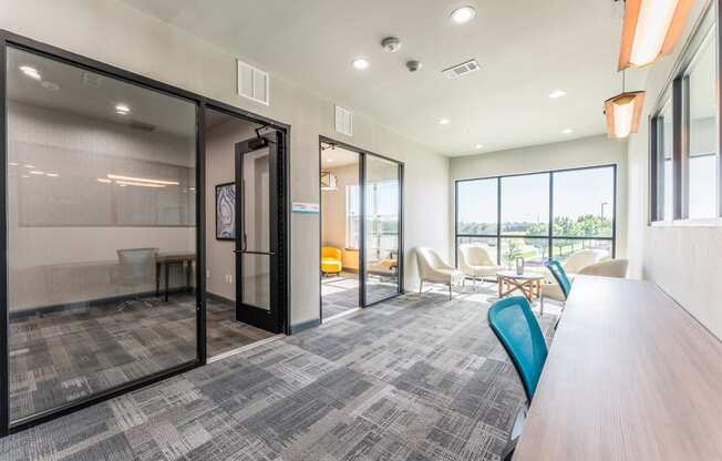 Conference room with glass doors and wide windows at Residences at 3000 Bardin Road, Grand Prairie