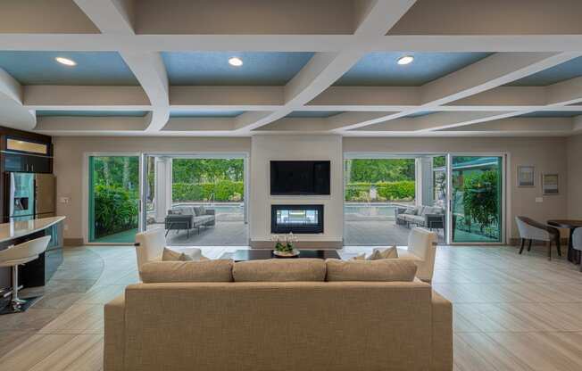 a large living room with a couch and a television