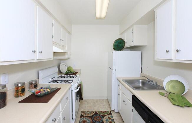 a kitchen with a stove and a sink