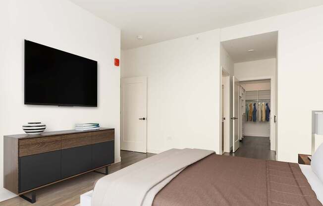 a bedroom with a bed and a tv on the wall at Cassidy on Canal, Chicago, Illinois, 60606