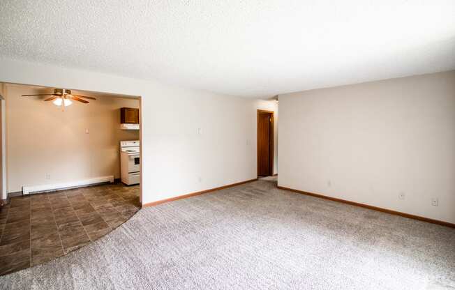 Bismarck, ND Eastbrook Apartments. A living room with the dining room in the background