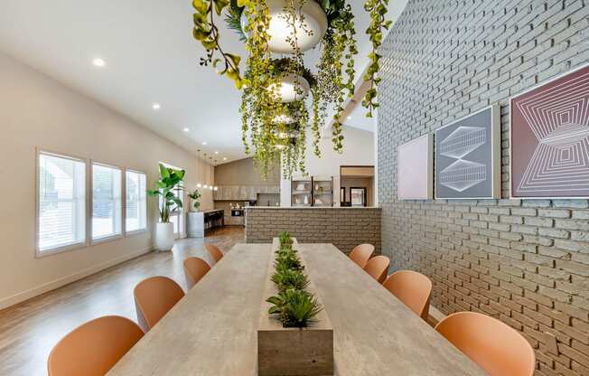 a dining room with a long table and chairs at Paisley and Pointe Apartments, Nevada, 89130