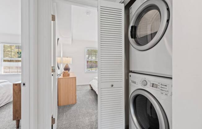 a small laundry room with a washing machine and a dryer