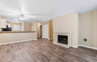 Saratoga Apartments in Everett, Washington Living Room with Fireplace and Kitchen