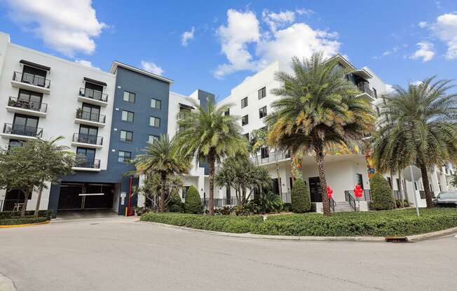 Shot of our building and entrance to parking garage with automatic gates at Bay Village 1 in Palmetto Bay, FL