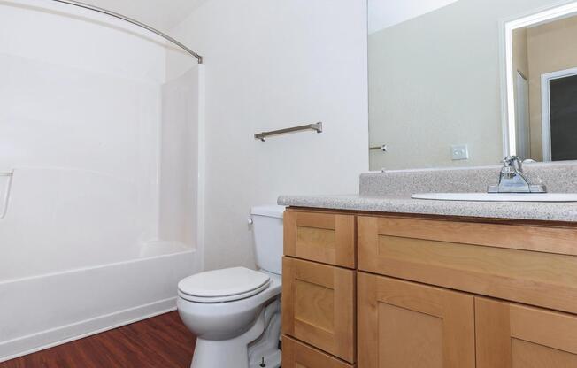 a room with a sink and a mirror