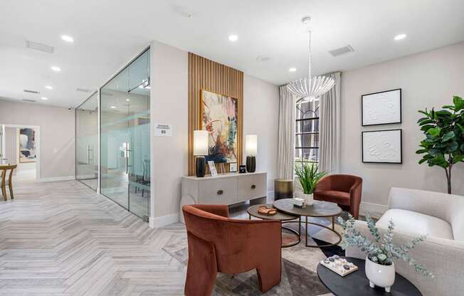 A modern living room with a brown chair and a white couch.