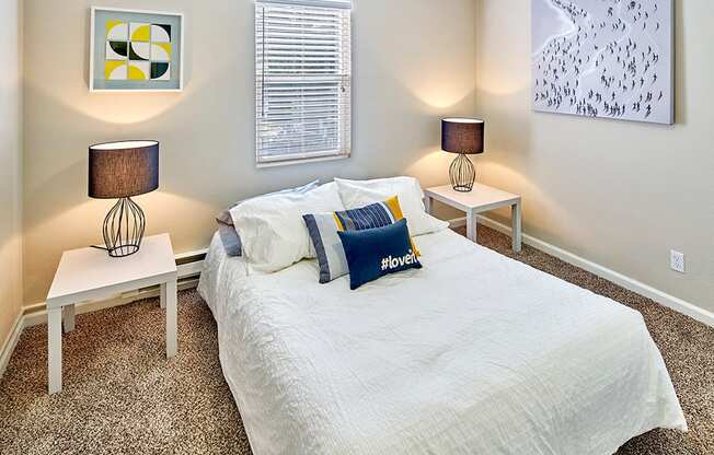 Carpeted bedroom to fit a queen sized bed and two side tables. One window over the bed.at Woodhaven, Everett, WA