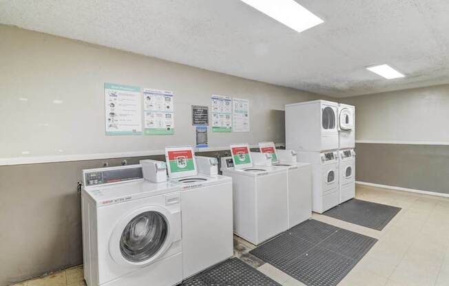 A row of washing machines in a laundromat.