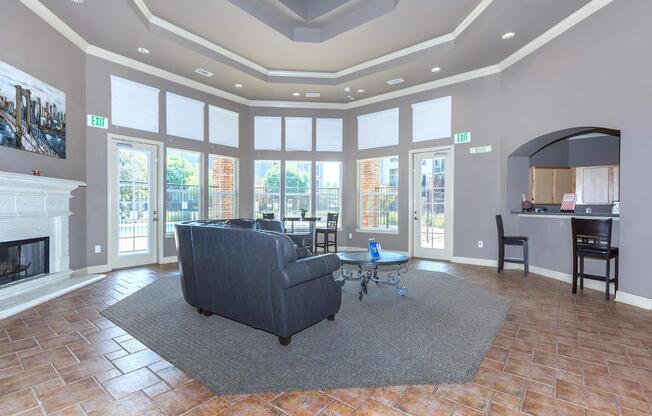 a living room filled with furniture and a large window