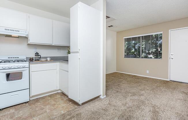 a white refrigerator freezer sitting inside of a kitchen