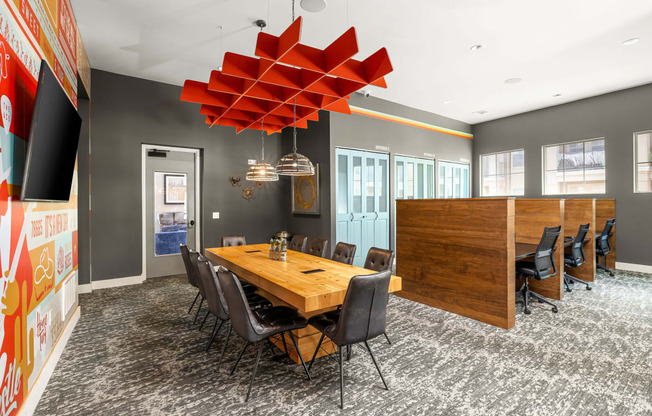 a conference room with a wooden table and chairs