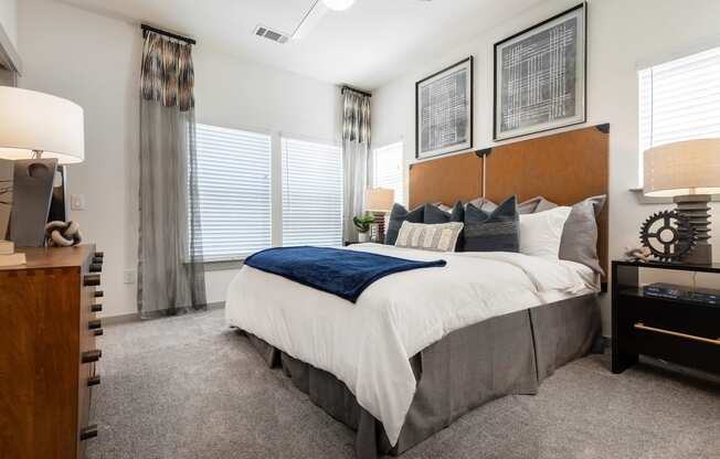 the preserve at ballantyne commons bedroom with large bed and windows