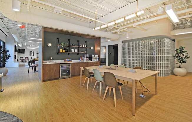 a dining room with a table and chairs