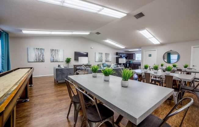 clubhouse with community table and shuffle board