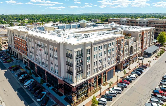 an aerial view of a large apartment building in a city