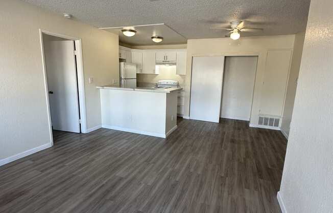 a view of the kitchen and living room from the top of the stairs