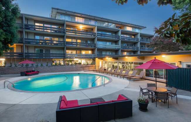 Outdoor pool area with lounge chairs