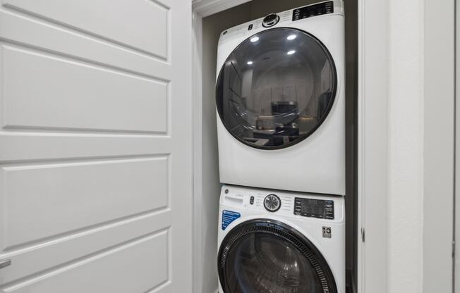 a front loading washer and dryer in a laundry room