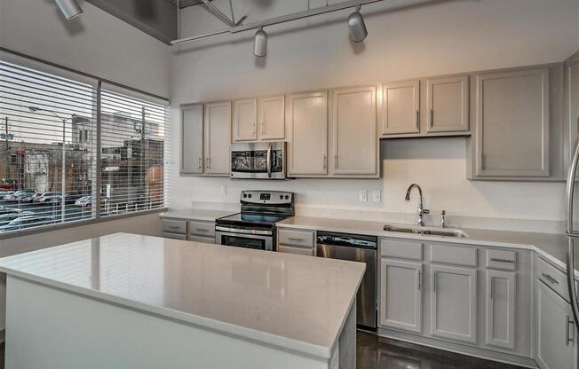 Kitchen With Custom Cabinetry at The Tower Apartments, Tuscaloosa, AL