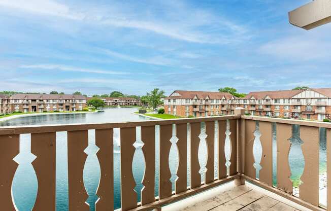 the view from the balcony of an apartment building overlooking a lake