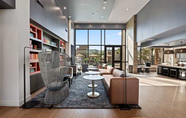 a living room filled with furniture and a large window