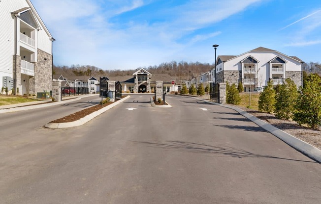 Ashland Farms Beautiful Gated Entrance to Apartment Community Surrounded by Lush Landscaping.