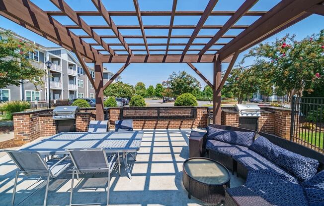 the preserve at ballantyne commons furnished patio with tables and chairs