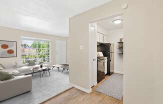 A living room with a couch, chairs, and a painting on the wall.
