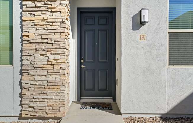 the front door of a house with a blue door