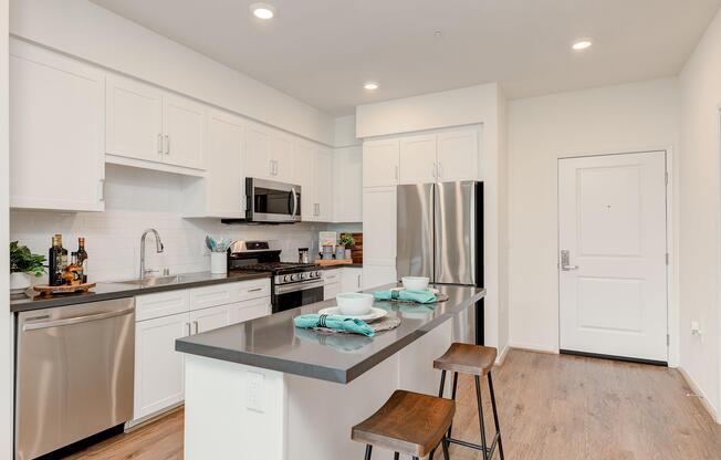 a kitchen with a stove sink and refrigerator