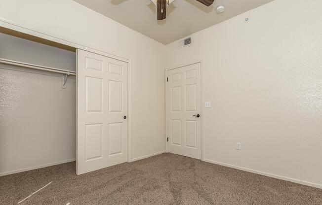 a bedroom with a large mirror