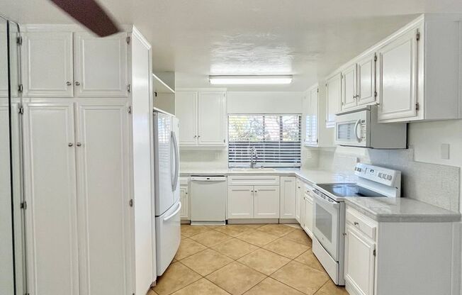 Spacious 3 Bedroom 2 Bathroom Town-Home with In-Unit Laundry, Pool and 2 Parking Spaces!