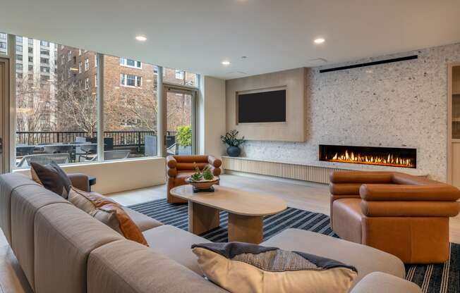 a living room with a couch and a coffee table and a fireplace