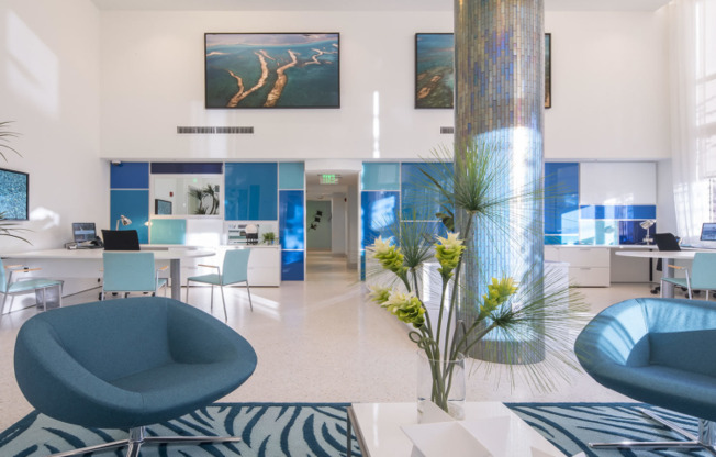 Leasing office with blue accents inside SOMA at Brickell apartments in Miami.