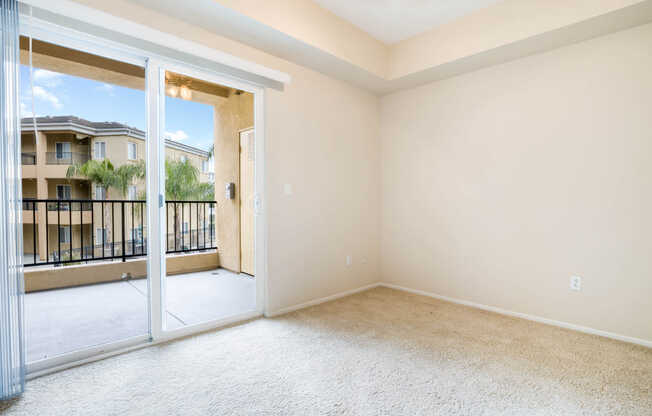 Carpeted Bedroom with Balcony