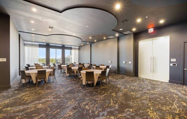 a large conference room with tables and chairs
