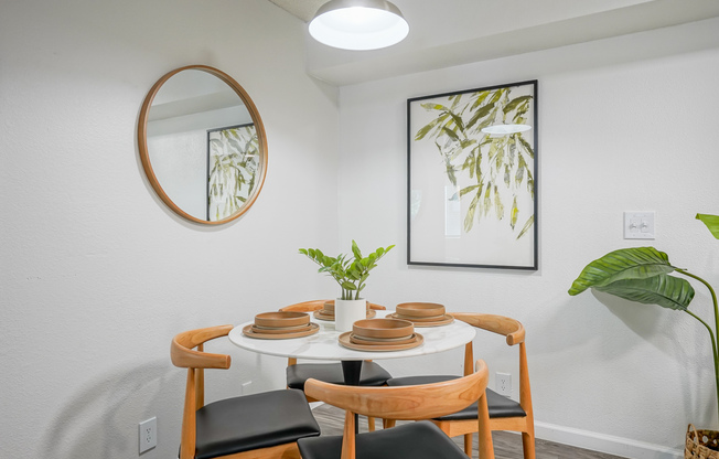 Set dining table inside platinum dining room interior at Treehouse in Albuquerque, New Mexico