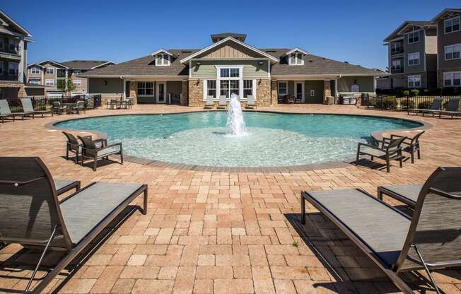 Madison AL Apartments for Rent - Arch Street - Sparkling Pool with Fountain in the Middle, Surrounded by Lounge Seating