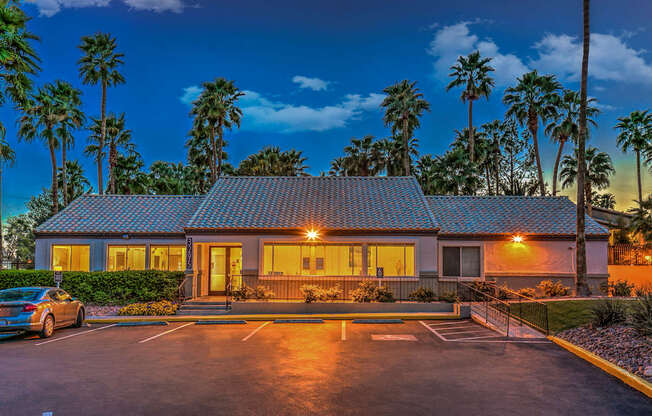 A building with a parking lot in front of it.