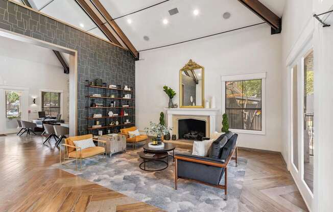A living room with a fireplace and a mirror on the wall.