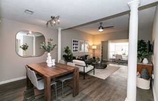 a dining room and living room with a table and chairs at Willowest in Collier Hills, Georgia