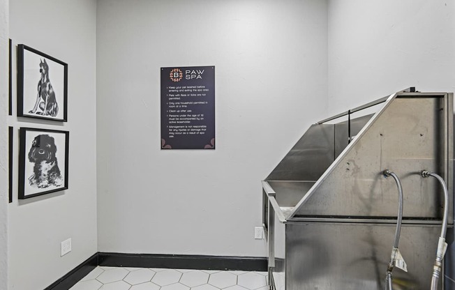 A room with a metal structure and a sign on the wall.