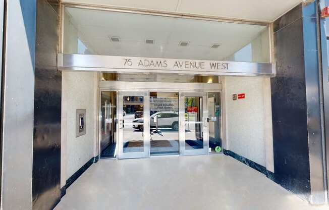 the entrance to the 79 adams avenue west building