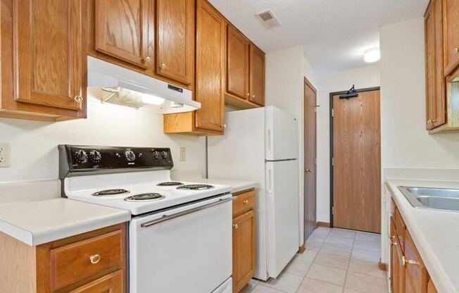 a kitchen with white appliances