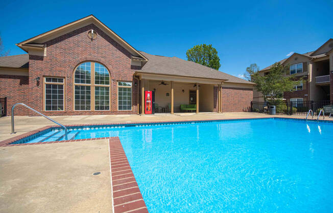 Swimming pool with the clubhouse in the back