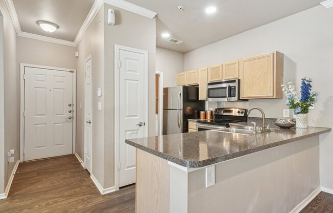 a kitchen with a granite counter top and a