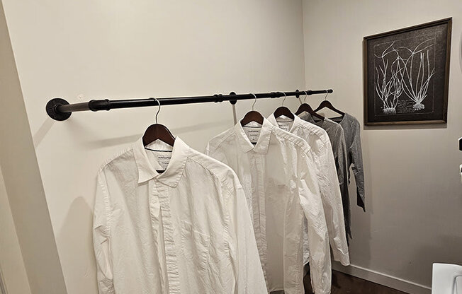 a rack with hanging white shirts at Lotus Republic Apartments for rent in Downtown Salt Lake City, Utah