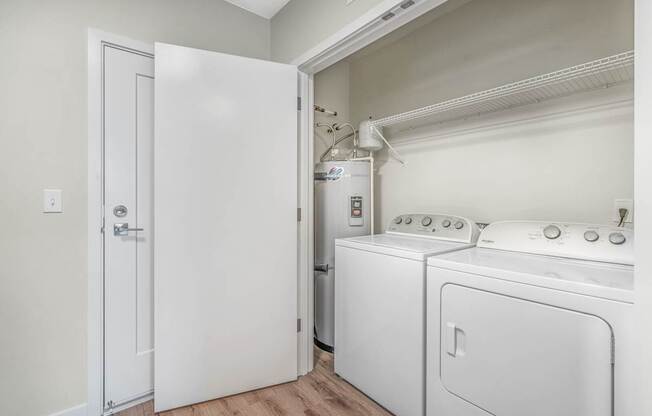 a laundry room with a washer and dryer
